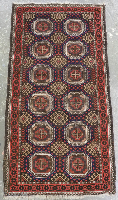 Size: 5ft 0in x 2ft 7in (152 x 79cm).

Antique Salar Khani Baluch rug with turreted gul design.

Circa 1900.

A very nice small Baluch rug, with a design of two rows of six large  ...