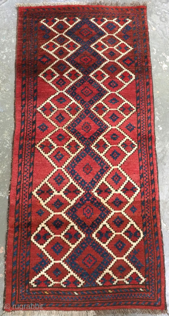 Size: 5ft 2in x 2ft 4in (157 x 72cm).

Antique Afghan village rug of interesting Turkmen inspired design, the rug is of a pleasing abrashed warm red colour with indigo blue and ivory,  ...