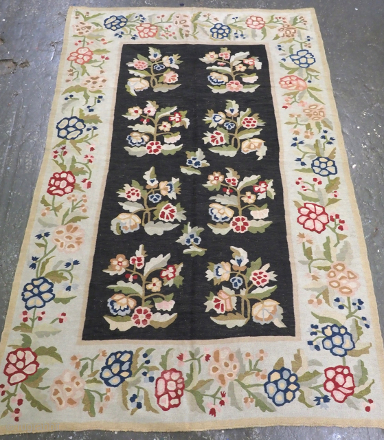 Size: 9ft 1in x 6ft 0in (278 x 184cm).

Antique Bessarabian kilim with large scale floral design on a black ground.

Late 19th century.

Bessarabian kilims originate from Eastern Europe; from an area that is  ...