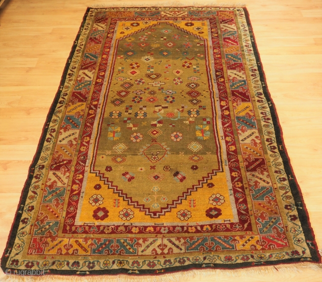 Antique Western Anatolian Milas rug of scarce design with superb soft wool and wonderful green ground. www.knightsantiques.co.uk 
Size: 6ft 11in x 4ft 4in (212 x 132cm). 
Circa 1875. 

This beautiful rug belongs  ...