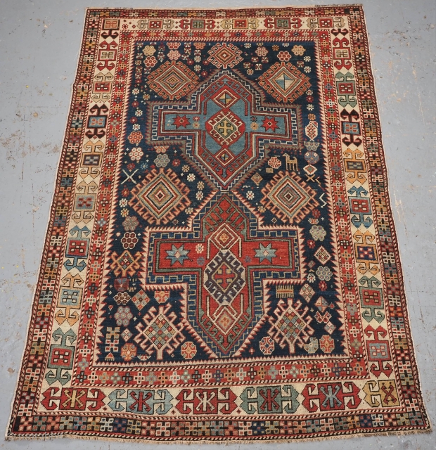 Antique East Caucasian Akstafa rug with twin medallions. www.knightsantiques.co.uk 
Size: 5ft 11in x 4ft 0in (180 x 122cm).
Circa 1890.

A good small rug with two cruciform medallions on a dark indigo blue ground.  ...