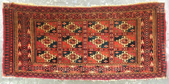 Antique Tekke Turkmen mafrash, face of a small storage bag. www.knightsantiques.co.uk 
Circa 1870 or earlier.
Size: 3ft 1in x 1ft 5in (95 x 43cm).
This small Tekke Turkmen mafrash is the face of a  ...