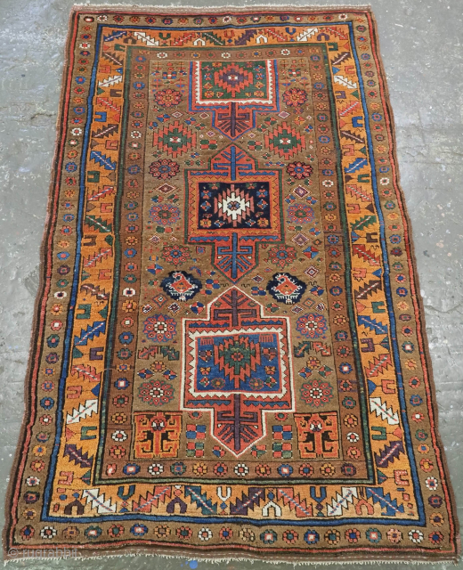 Antique Kurdish rug with a medallion design on a camel ground. www.knightsantiques.co.uk 
Circa 1800.
Size: 7ft 1in x 4ft 5in (216 x 134cm).
This Kurdish rug belongs to a group of rugs woven in  ...