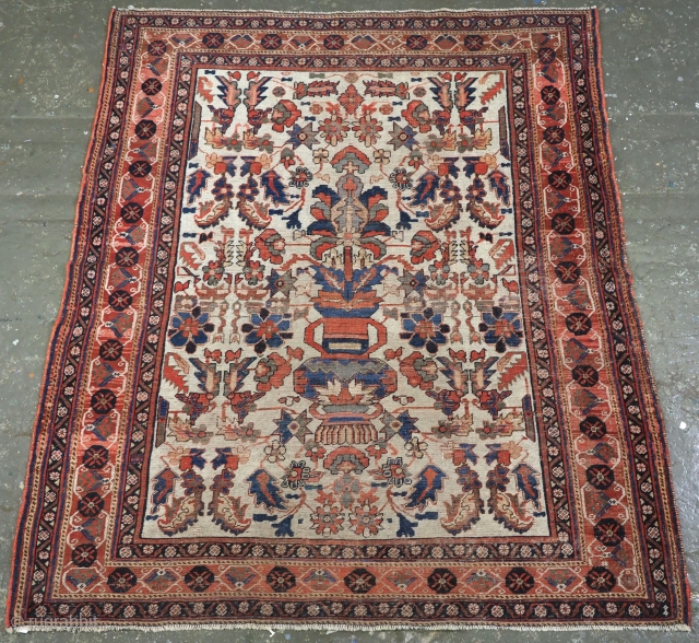 Antique 'Kirman' Afshar rug of 'vase' design on an ivory ground.
www.knightsantiques.co.uk
Mid 19th century.
Size: 5ft 0in x 4ft 6in. (153 x 137cm).
This is a scarce rug of very fine weave, the design is  ...
