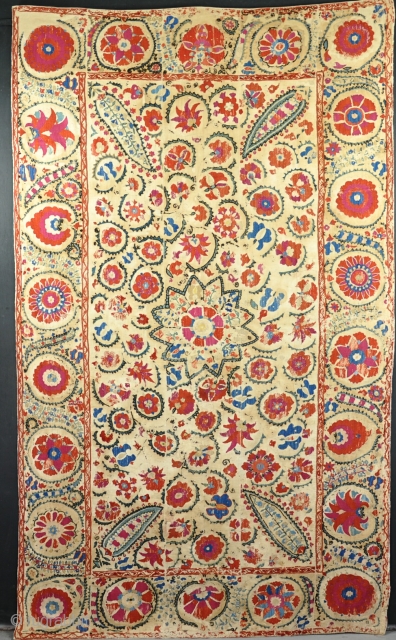 Antique Suzani, some rubbed areas and damage to linin ground, but professionally conserved and backed. Mid 19th century.               
