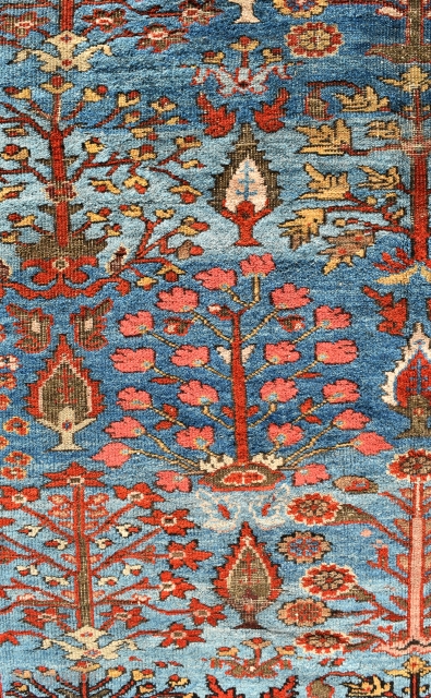A highly unusual antique Ferahan carpet with beautiful sky-blue ground and an allover design of trees. 
Mostly in pile, some low areas, browns corroded in places, some small local repairs of high  ...