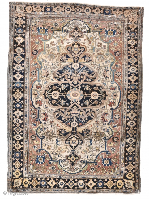 A fine antique Moteshem Kashan rug. Finely made with the beautiful wool and weave synonymous with the master weaver. Some corrosion/low pile, some small holes to ends Professionally conserved) remnants of original  ...