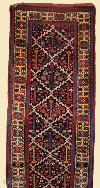 3'7" x 13'2"     Antique tribal runner. Circa 1900.  Probably Northwest Persian but with Bakhtairi or Luri characteristics.
Navy field with a "Shrub" design. Beautiful yellow border. Generally excellent  ...