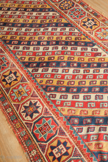 Genje or other Caucasian regional rug.  19th century.  Outstanding colors and striking eight-pointed star border.  Some wear along the sides here and there. 137 x 210 cm   