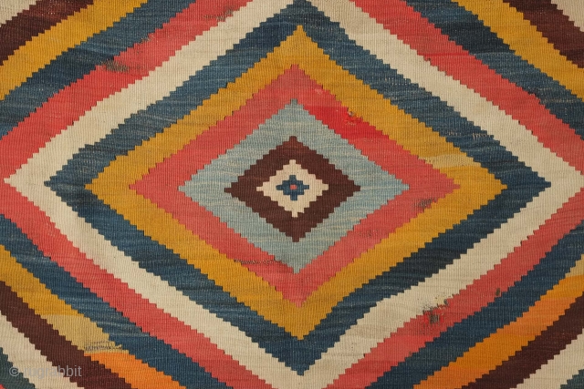 Qashqa'i kilim, 19th/early 20th century. Evocative concentric diamonds in variegated natural dyes. An abstract work of art.  Playfully place small diamond motifs. Some small areas of wear shown in the images.  ...