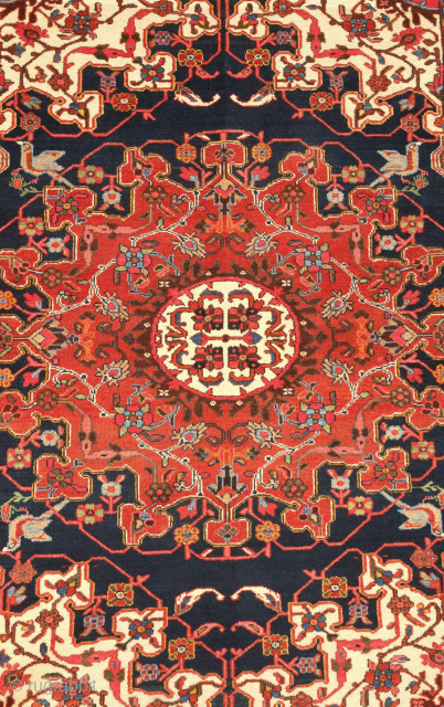 Hamadan rug, late 19th, early 20th century.  It bears an exquisite central medallion in Chinese cloud band and cloud collar elements. The medallion is flanked with birds in the four corners.  ...