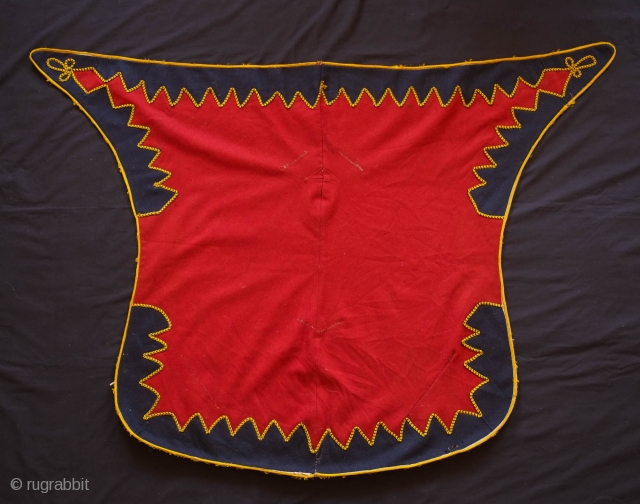 Balkan Ceremonial Saddle Cover, 1900 or so.  This is put together from sturdy broadcloth and yellow and blue cording.  It has wonderful colors and striking zigzag design.  The backing  ...