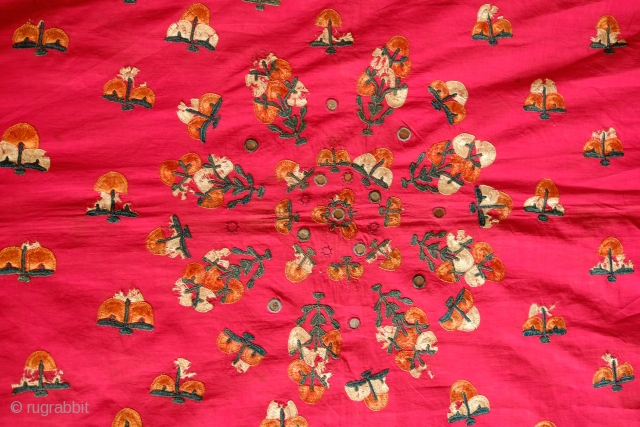 Phulkari, Late 19th century. Wonderful rich red ground with orange, green and white silk. In all around good shape with a bit of tear in the top left corner.  148 x  ...