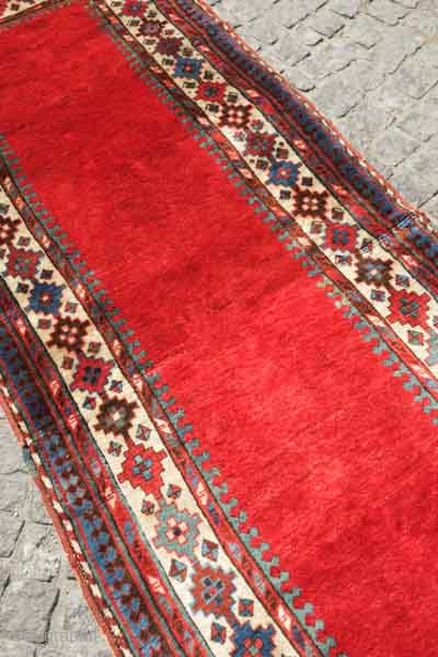 Talish long rug, 19th century.  Vibrant less commmon red ground. Excelllent colors and full pile.  The rug was damaged across the middle and reconstituted with excellent old wool making it  ...