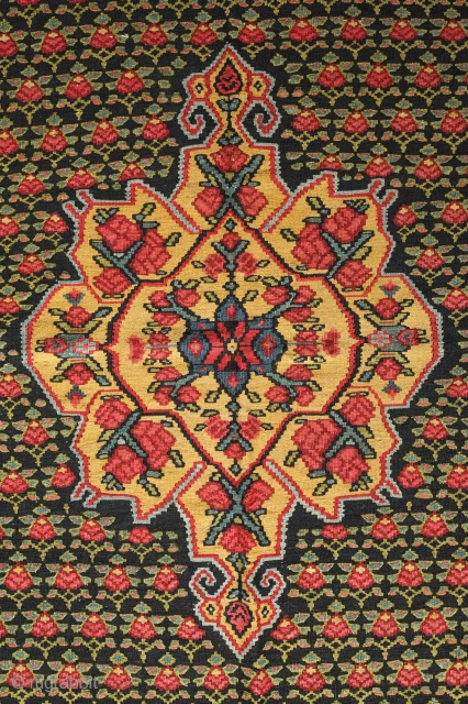 Senneh Kilim, 2nd quarter of the 20th century.  Great natural colors.  Field full of pink and green flowers.  A rich, striking kilim.  140 x 207 cm.   