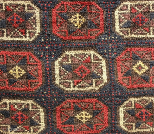Baluch saddle bag face, late 19th century. Eight-pointed star design.  Some damage in the top left-hand corner but patched up.  62 x 62 cm       