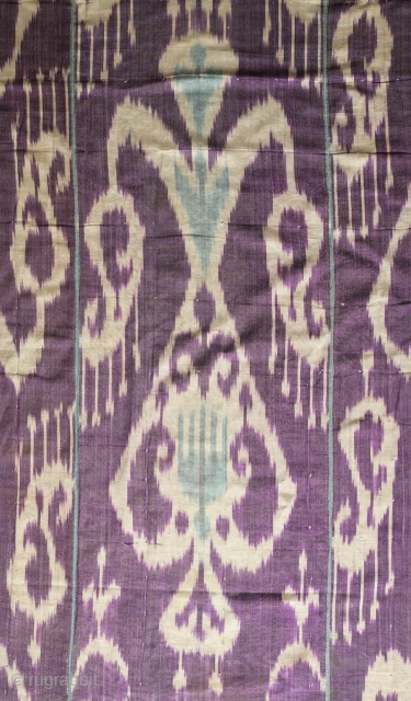 Ikat Adras Hanging Panel, Late 19th to early 20th Century.  Possibly Ferghana Valley.  Purple ground with three types of white pendants.  Five strips.  173 x 214 cm  
