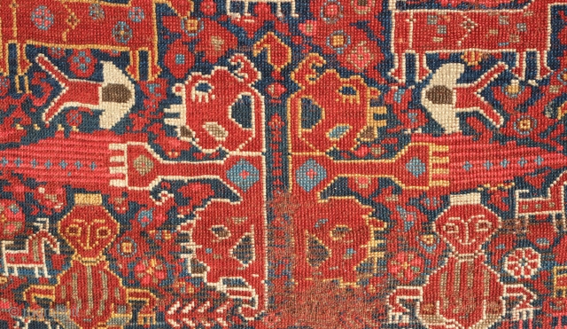 Khamseh rug, 3rd to 4th quarter of the 19th century.  A wonderful array of mounted tribesmen in the field amidst unique half abstract winged medallions.  The field is filled with  ...
