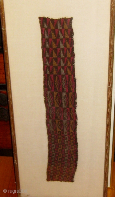 Framed Pre-Columbian (Chancay) textile fragment, either belt or headband, with 3 repeating patterns in succession, 11" by 27" frame size, 3" by 20" fragment size.  Please ask for additional photos  