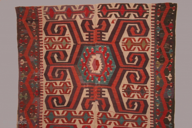 Anatolian kilim with three large central medallions, 5 x 14 feet, circa 1800. condition: substantial reweaving of black in borders, some reweaving in the field as well. The composition of the elements  ...