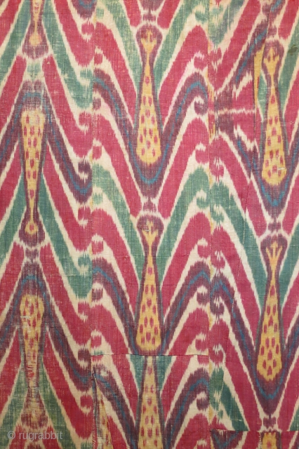 Uzbek ikat wallhanging, silk warp, cotton weft, 19th century, 46 x 58 inches, lining of hand spun hand woven cotton with a stamped or resist dyed design. The many fabric pieces comprising  ...