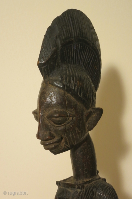 Yoruba female figure, Nigeria, wood, 14 inches high, mid 20thc.,Ex Irwin Hersey col.                    