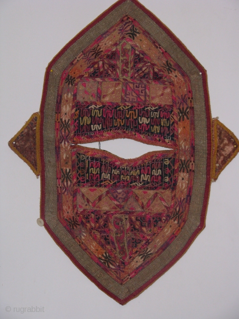 This turkmen child kirlik is an hand stitched silk on cotton in a fair condition
the wear on some spots shows that it was used by a very active child for a long  ...