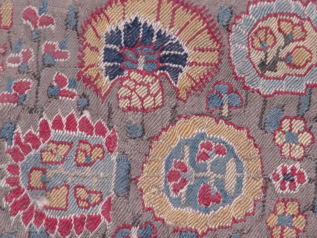 This fragment is a very old textile from Iran(kerman),1800's piece for sure its backed up with some other cloth and cotton in between 
















         