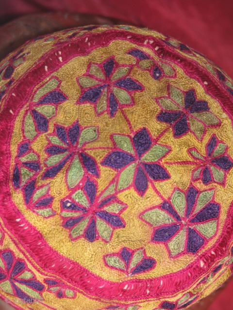 This beautiful hand stitched silk on cotton hat is an early turkmen piece,very fine work and it's a child hat             