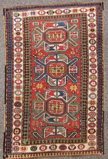 KARABAGH. Antique and well preserved with very limited wear. Almost high piled all over. All borders original.UNIQUE WHITHE BORDER WITH STARS! Size 234 cm x 158 cm
SOLD      