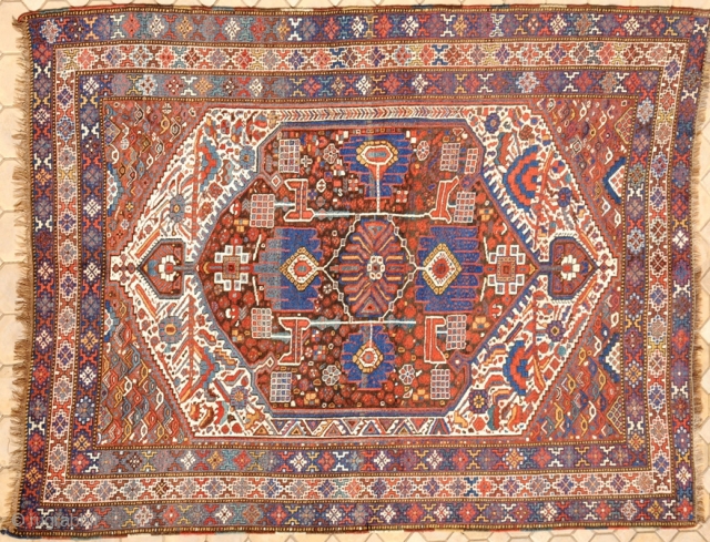 RUG NO : 23 
 
SIZE : 306 x 206 
 
TYPE : Antique 1900 
 
ORIGIN : Iran 
 
DESIGN : Arab Khamseh 
 
CONTENT : Wool on wool 
 
BACKGROUND  ...