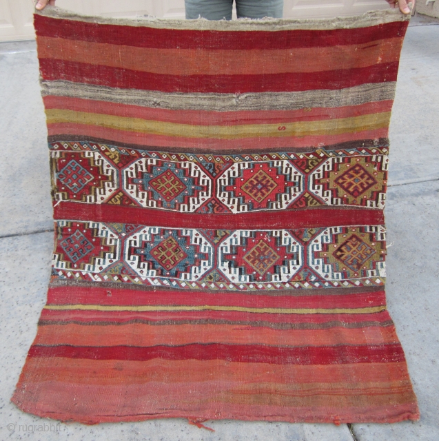 19th Century Central Anatolian Çuval utilitarian kilim... an attractive piece with nice colors. Areas of obvious wear with a few holes. All natural vegetable and root dyes. Cotton weaving in the center  ...