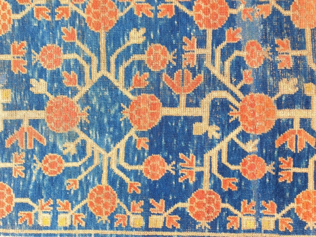 Antique pomegranate Khotan end 2nd half XIX century,
Both ends restored and other old repair.
Happy colors 
cm 245x120
Professinally washed, for other images please ask          