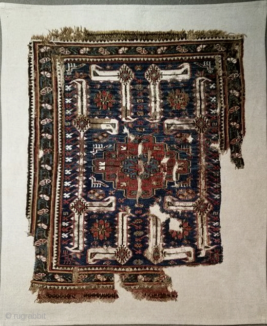 Khorjin face fragment with white cotton leaf-arabesques, Baku district, 
sumak, 19th cent., mounted on linen, 64 x 49 cms; for analogy, see Wertime,  Sumak Bags, pl. 101.     