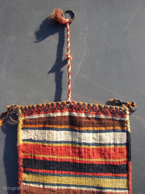 South Persian Tribal,Qashqai ? . Chanteh/Bag/ 'qalyandan,  Wool on wool and some cotton .Sumak and Kilim technique. First quarter 20Th.Cnt. 42 x 29 cm. Including tassels,and topstrap + ring 106 cm. 