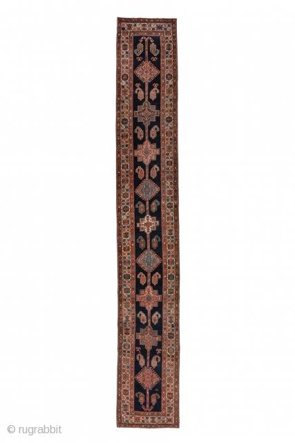 Northwest Persian Runner

2.9 x 18.3
0.88 x 5.57

A long pole medallion ending in double hooks is composed of hooked lozenges and stepped octogrammes on the navy ground. Serrated botehs flank the central motif  ...