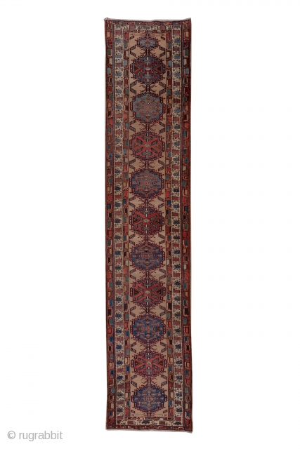 Sarab Runner

3.3 x 15.1
1.00 x 4.60

The light camel-tone field of this well-woven rustic NW Persian runner displays 10 characteristic  Sarab hooked
 cartouche medallions formed into a central pole device. The medallions  ...