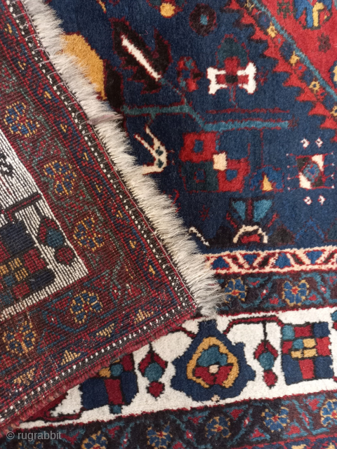 Can someone please identify the type of carpet for me? Is it an antique Shiraz? Because I don't see any Shiraz motifs.           