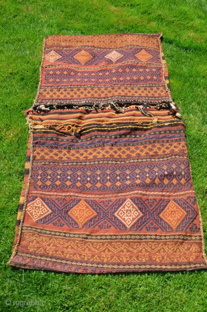 Baluch kilim flatwoven khorjin. 5’5”X2’7”. First part 20th C or earlier. Wool. Natural dyes. Few signs of use/small patches on striped back. Light cheery palette is unusual. Washed by me.   