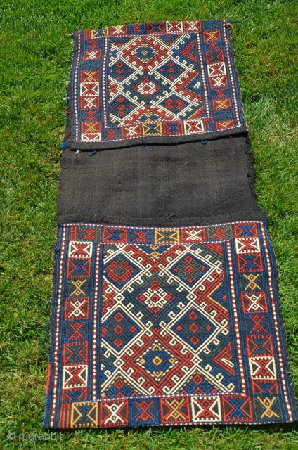 Antique  Azeri brocaded khorjin. 48" X 20" Late 19th C.Faces with brocaded geometric designs. Warm natural colors. Plainnwoven black back- black backs usually signify an early date.  Except for a  ...