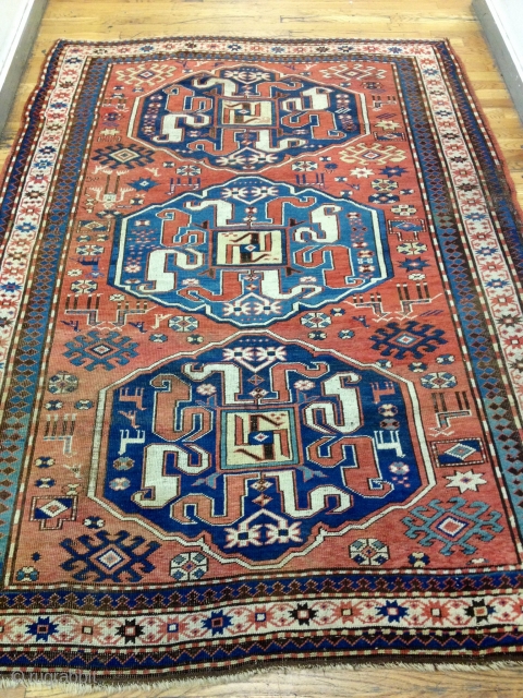 CAUCASIAN CLOUDBAND KAZAK
5'2 by 7'5 ft
Ends and sides are in perfect shape
1880's or earlier
No restoration done
Black oxidations
Ethnic and primitive designs
Vibrant,brilliant colors
            