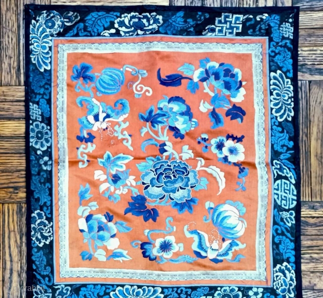 1’1 x 1’3 Chinese Embroidery Panel, 19th Century, featuring peony blossoms and 
butterflies embroidered in shades of blue and white on persimmon orange          