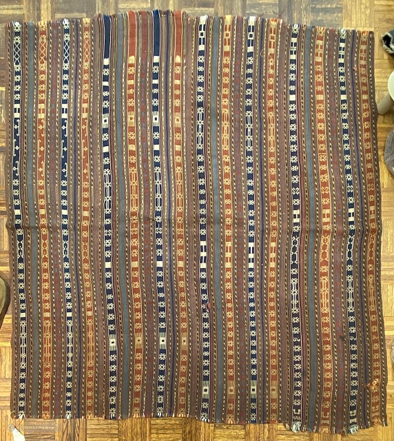 Jajim, ca. 1890; 5’9” x 6’0” / 175 x 183 cm.

Field adorned with multicolored bands and totemic symbols, wear at the sides, a few discreet 

holes, and one re-sewn cut.   