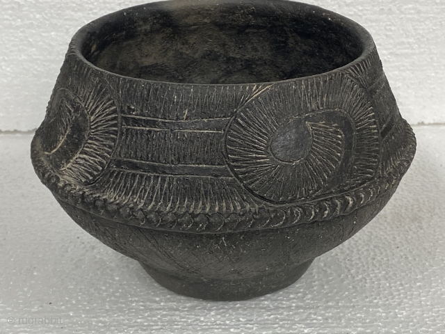 Bang Chaing Vessel / Bowl, black, Bronze Age, ca. 1st - 2nd Millenium BCE; 5”/ 12.7 cm height; 

Purchased from a Legitimate Educational Institution Auction sale

Upper hemisphere decorated with large curls containing  ...