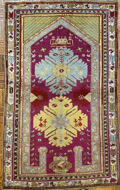 Kirshehir Turkish Prayer Rug, ca. 1890; 3’ 5” x 5’ 4” / 104 x 163 cm

Re-entrant prayer rug with cochineal field with some madder red and

fuchsine details. Two large “snowflake” medallions, plus  ...