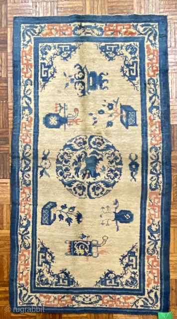 Ningshia Chinese Rug, 19th C; 3’11” x 5’ 10” / 119 x 178 cm

Foo-Dog medallion at center of field with arrangements of

meritorious “scholars’ objects”. Fret-work dragons in the 

main border woven in  ...