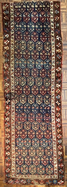 Antique Kurdish Runner Fragment, ca 1850; 3’5” x 9’5” / 104 x 287 cm

113-inch long fragment of an indigo ground Kurdish runner with a beautifully drawn rendering of

oft seen floral ovoid with  ...