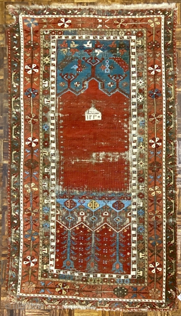 Antique Ladik Prayer rug, dated A.H. 1230 ( 1815 CE); 3’7” x 6’5”

Woven a relatively long vertical shape, this Ladik features the classic

arrangement of a red, triple-arch mihrab set above a panel  ...