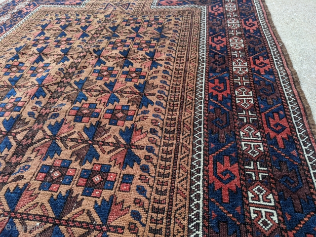Wonderful 19th century Antique Baluch prayer rug. It's mostly medium pile with some colors which have corroded over the years. Soft wool. Rare with the rosettes on the main tree of life  ...
