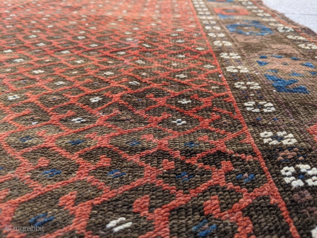 Fun little old Baluch. Great for use as a scatter rug or any space. Love that glowing red field to outline the botehs. 

5ft6in x 3ft1in or 168 x 94cm

Low pile, one  ...